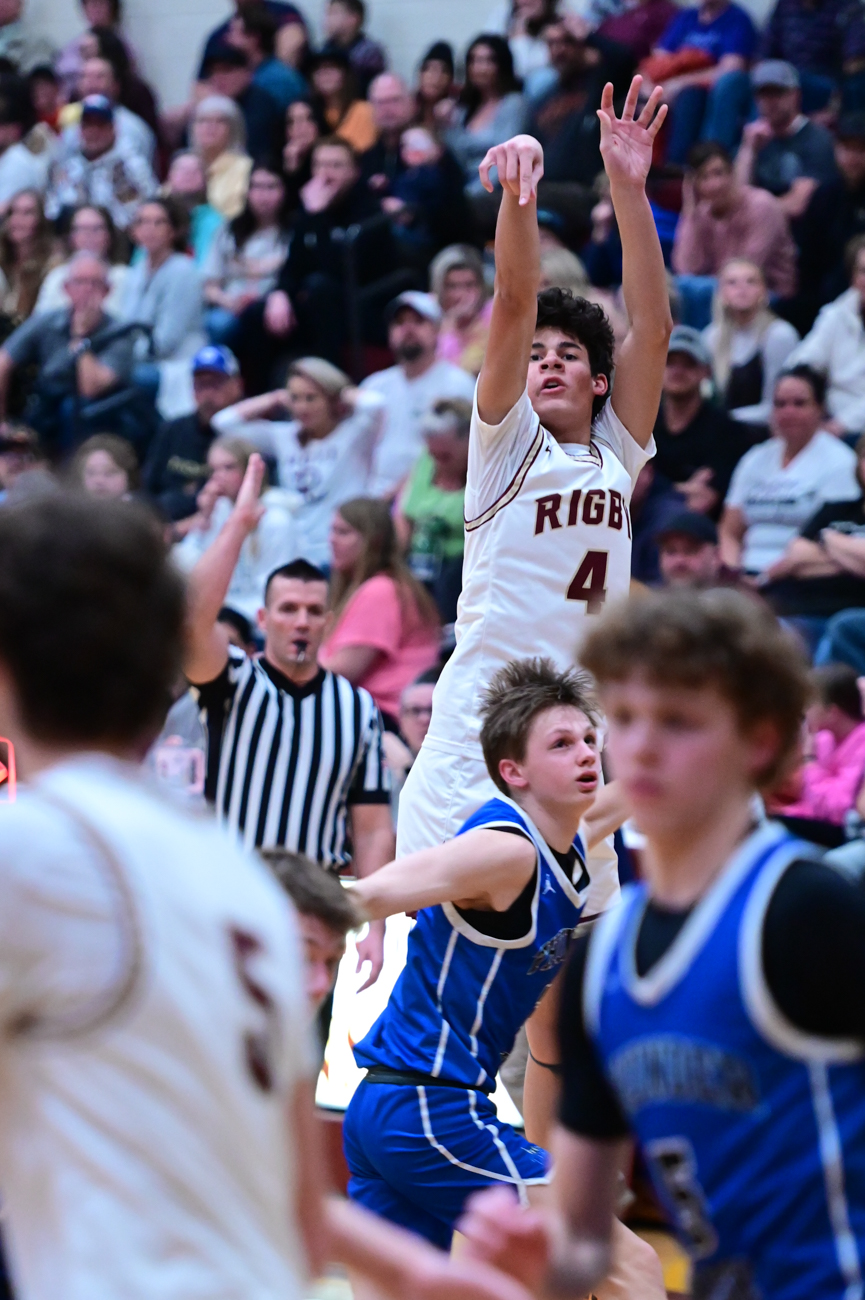Royce Castle shooting over a defender in game action